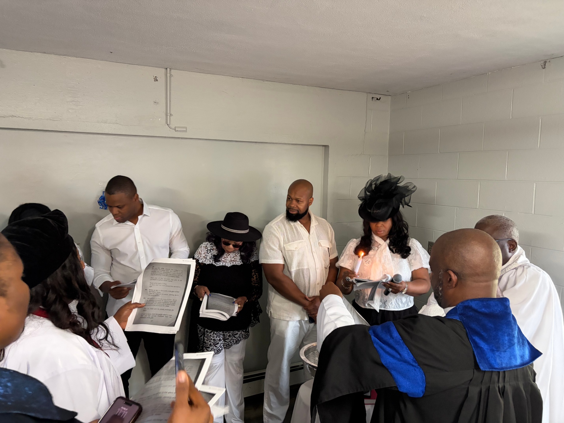 The church family joins in prayer and song