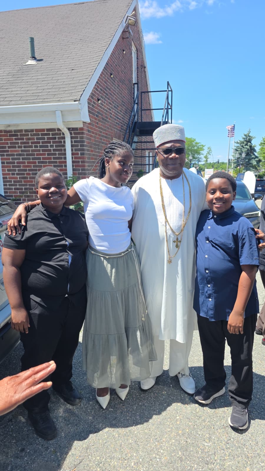 His Royal Majesty posing with the Rector's children under a bright summer sky