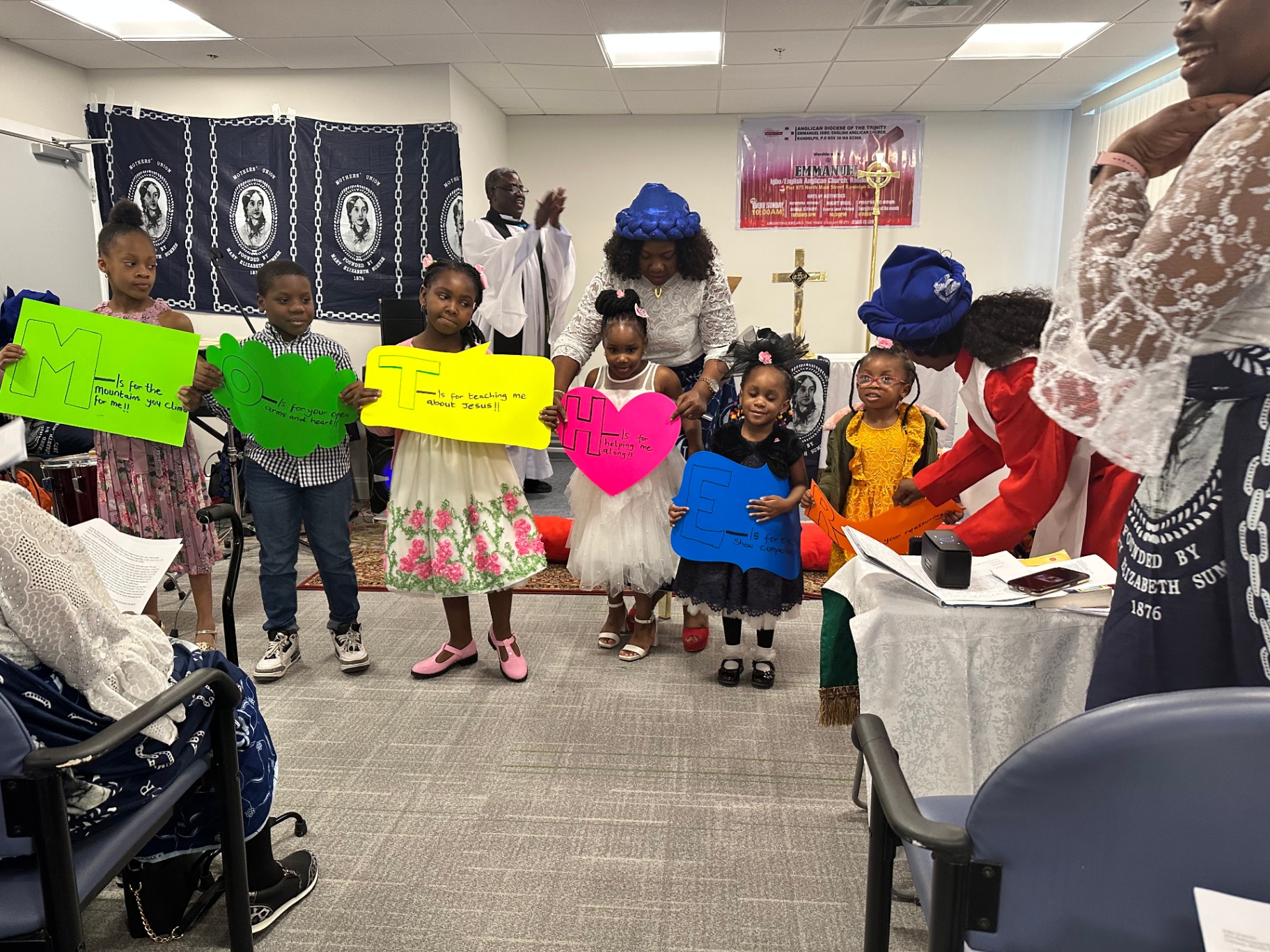 Children's M-O-T-H-E-R tribute performance