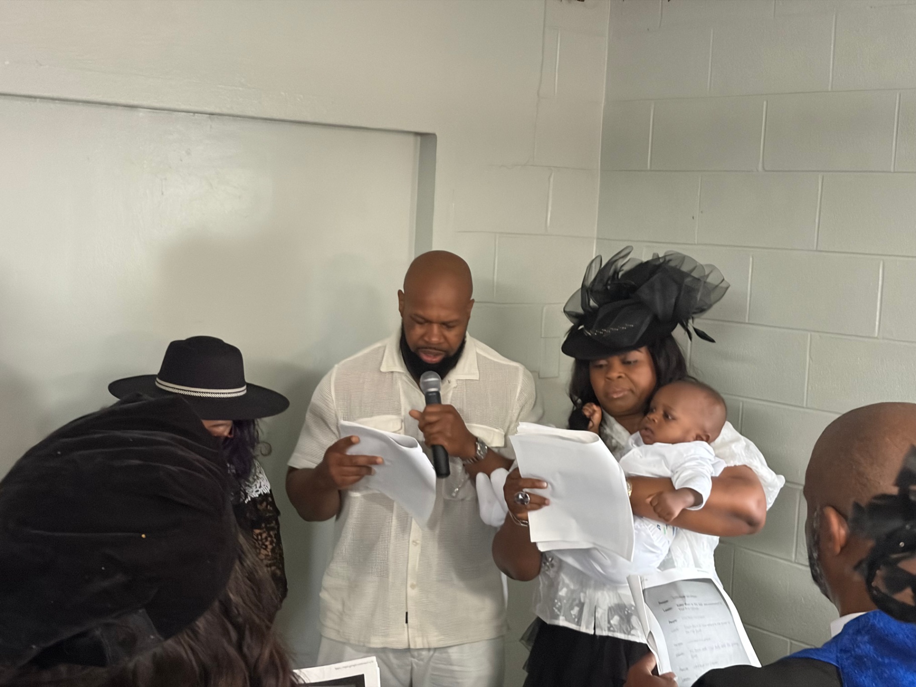 Parents present their child before the Lord and the church