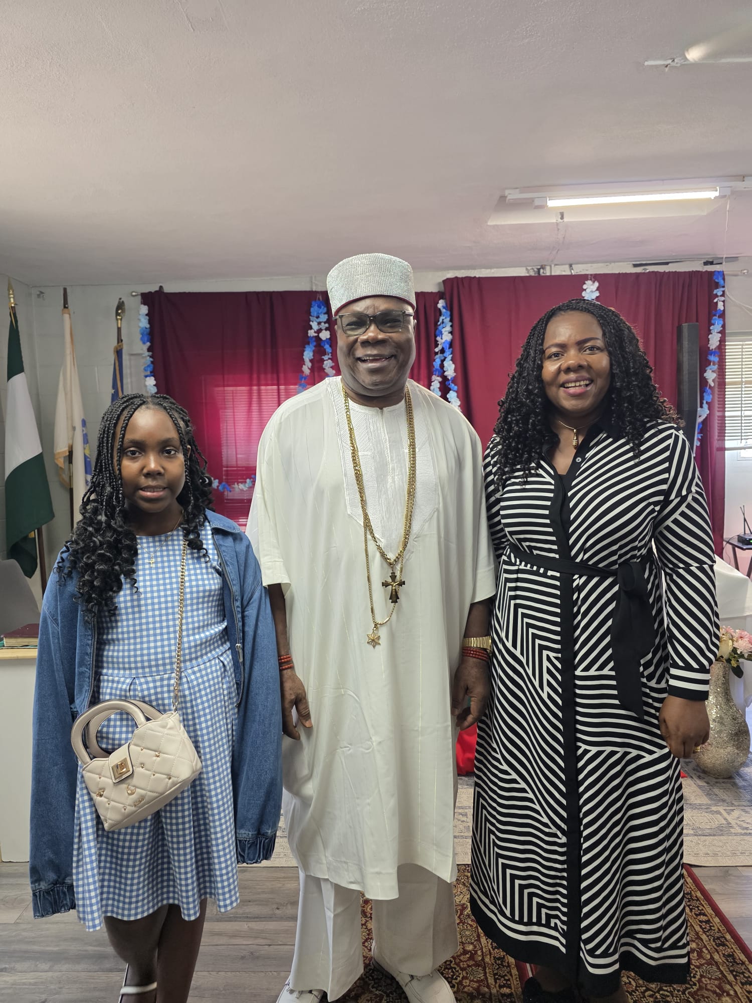 His Royal Majesty takes a picture with a family after the thanksgiving service