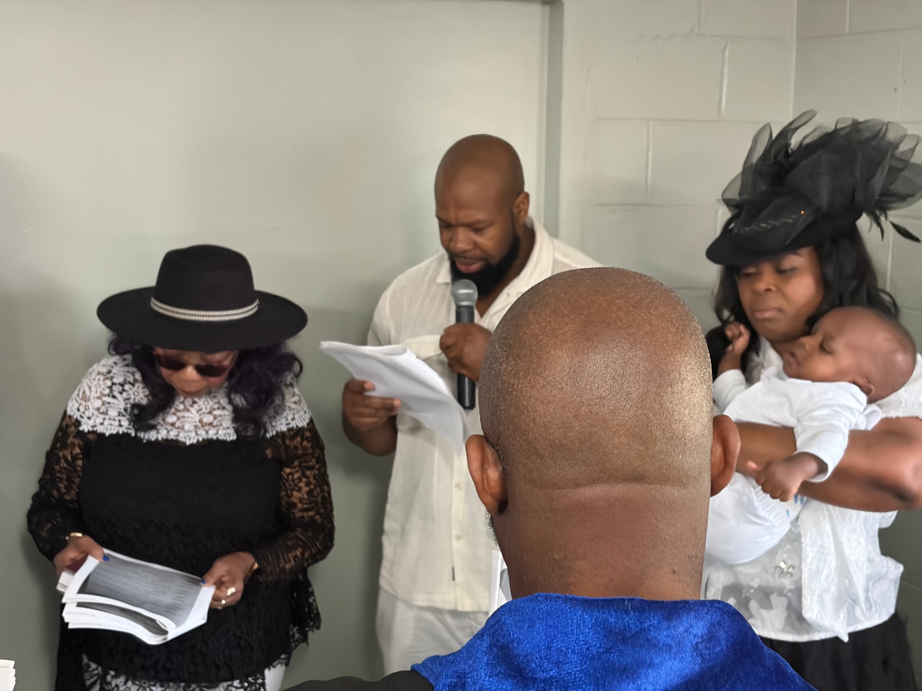 Family making their dedication vows