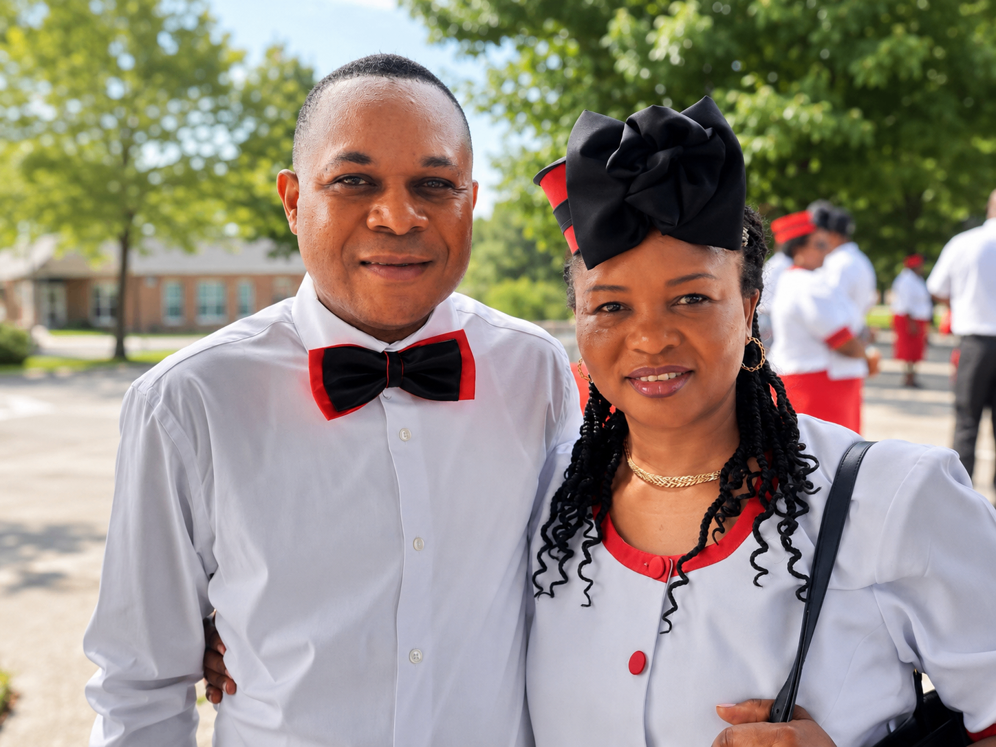 Knight and Dame outdoors after the service sharing fellowship during the investiture day